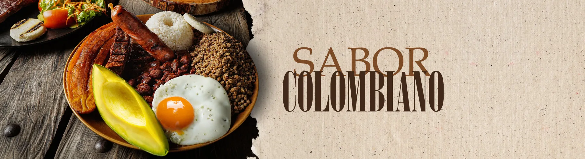 Plato de cocina colombiana con arroz, huevo, aguacate, fríjoles y carnes